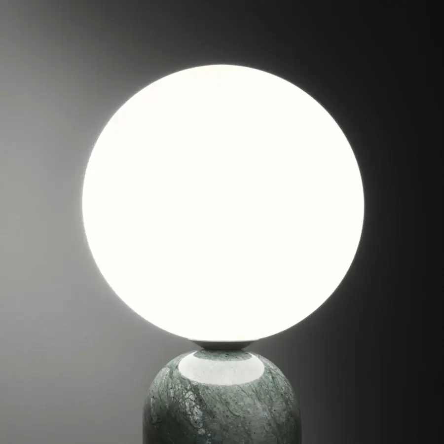 Exceptional Contardi Emma table lamp crafted in mottled green and grey marble with a white opal glass sphere diffuser