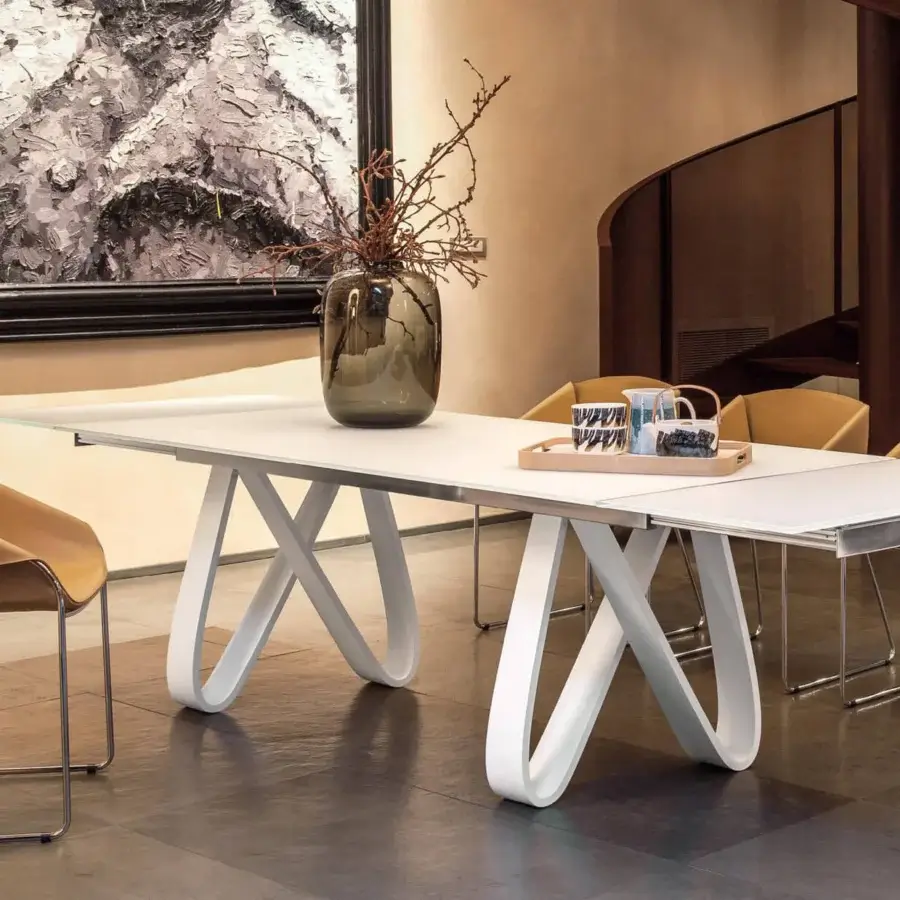 Exceptional Tonin Casa Butterfly Ext table crafted in travertino with a glossy white base and gracefully curved legs