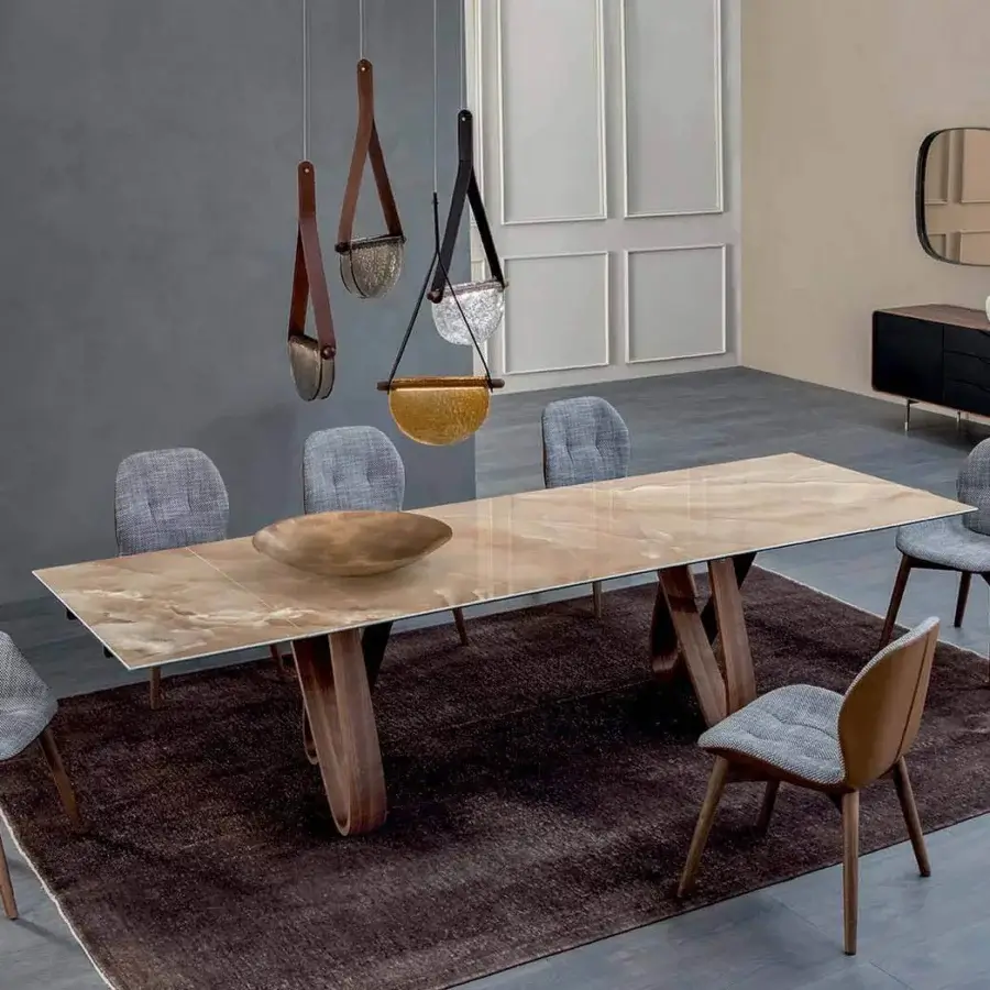Superior Tonin Casa Butterfly Ext table built in travertino with a polished ceramic tabletop and warm beige brown hues