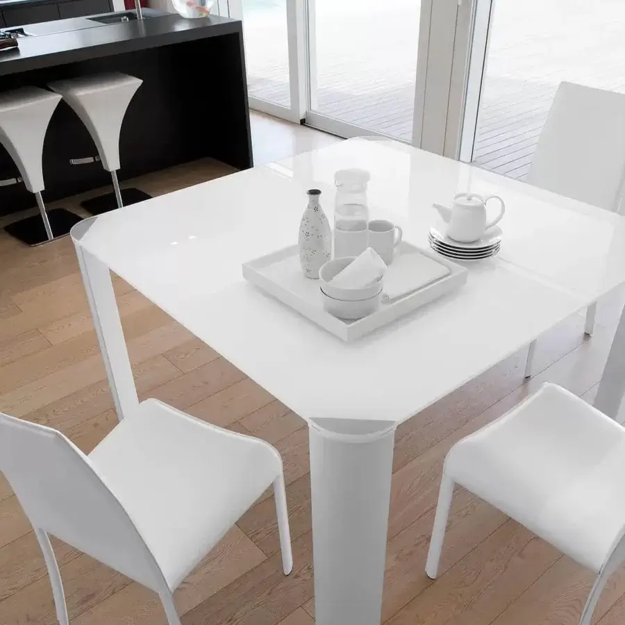 Elegant Ivano Antonello Italia Scott dining table with aluminum legs and clear tempered glass, finished in high-gloss white