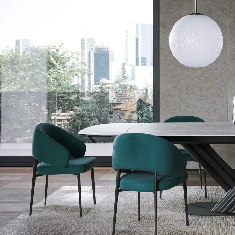 Distinguished Tonin Casa Astra armchair with softly curved silhouette and deep teal textile upholstery built with a painted metal base