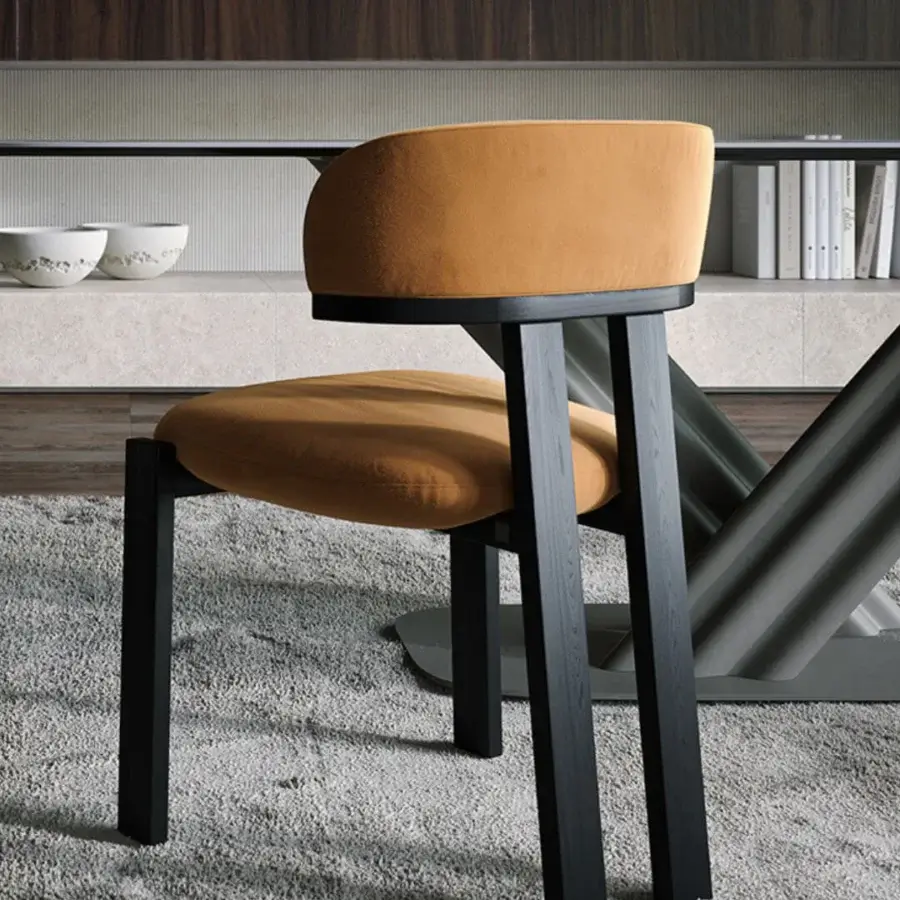 Elegant Tonin Casa Camila chair with sumptuous golden-yellow velvet upholstery and dark finished metal frame