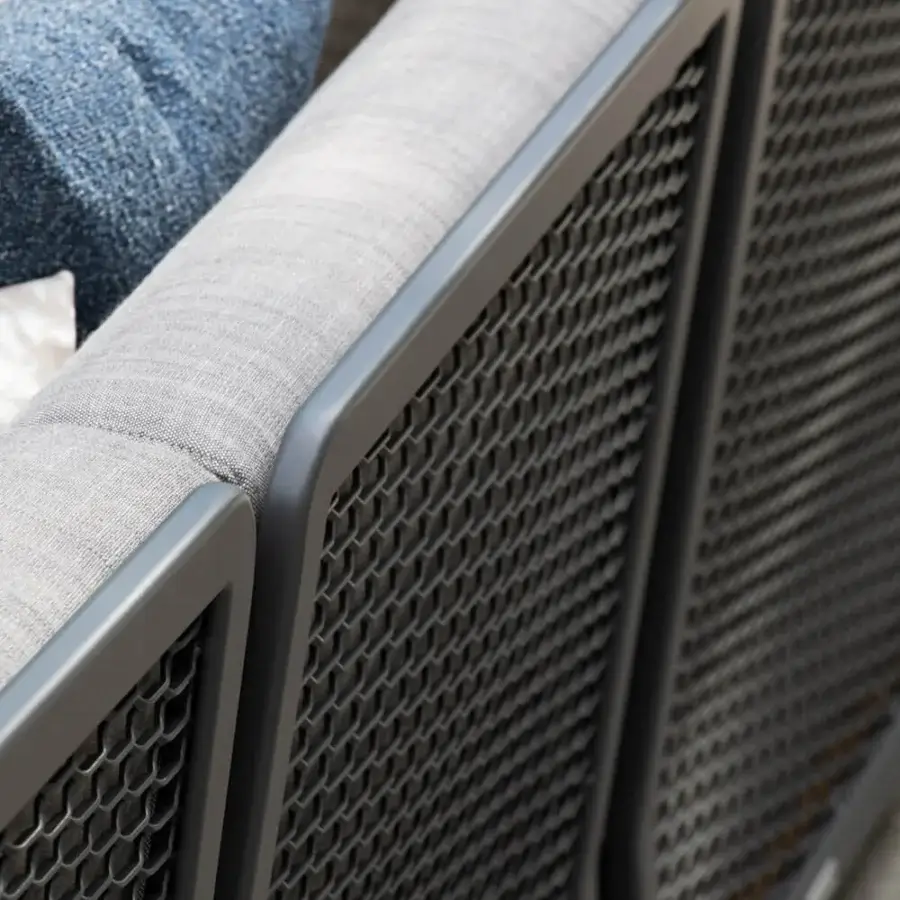 Superior Atmosphera Switch sofa built with a dark gray aluminum frame and comfortable light gray cushions with a blue bolster