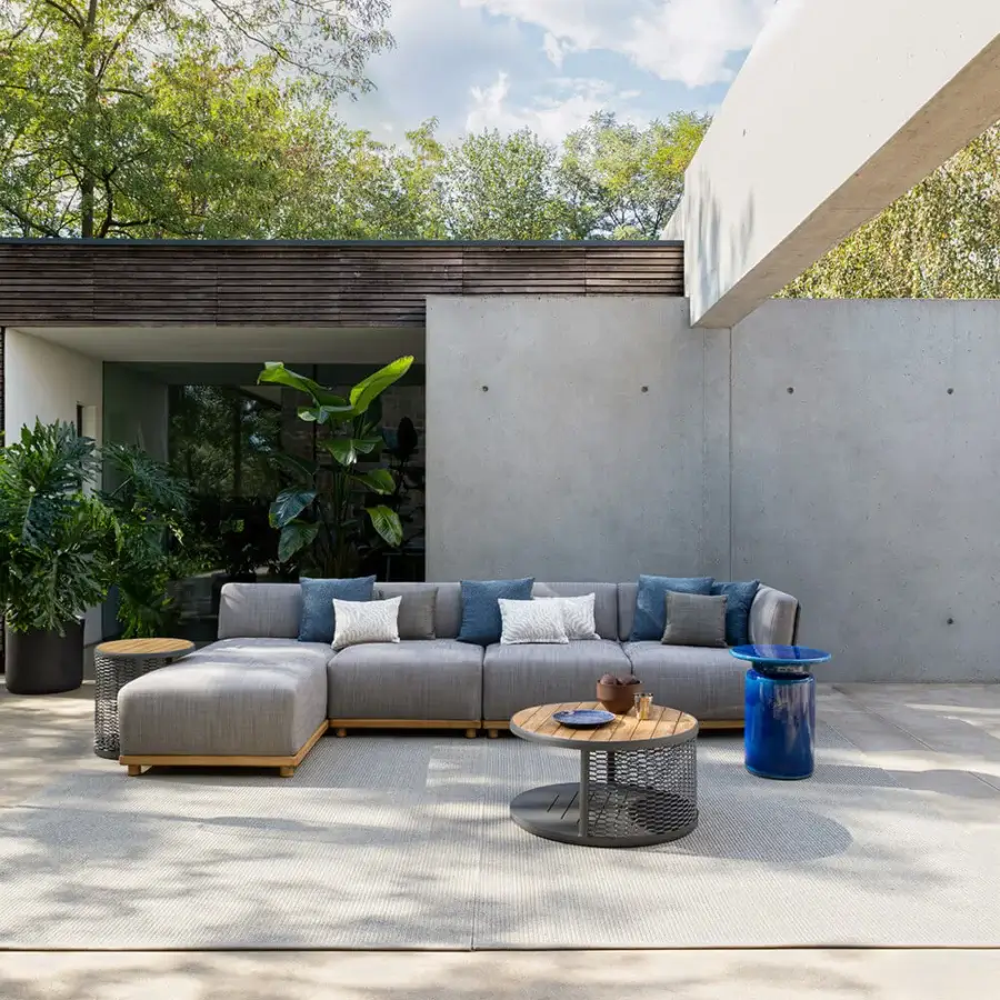 Distinguished Atmosphera Switch coffee table with a woven texture inset in a satin-finish wood tabletop and deep blue cylindrical base