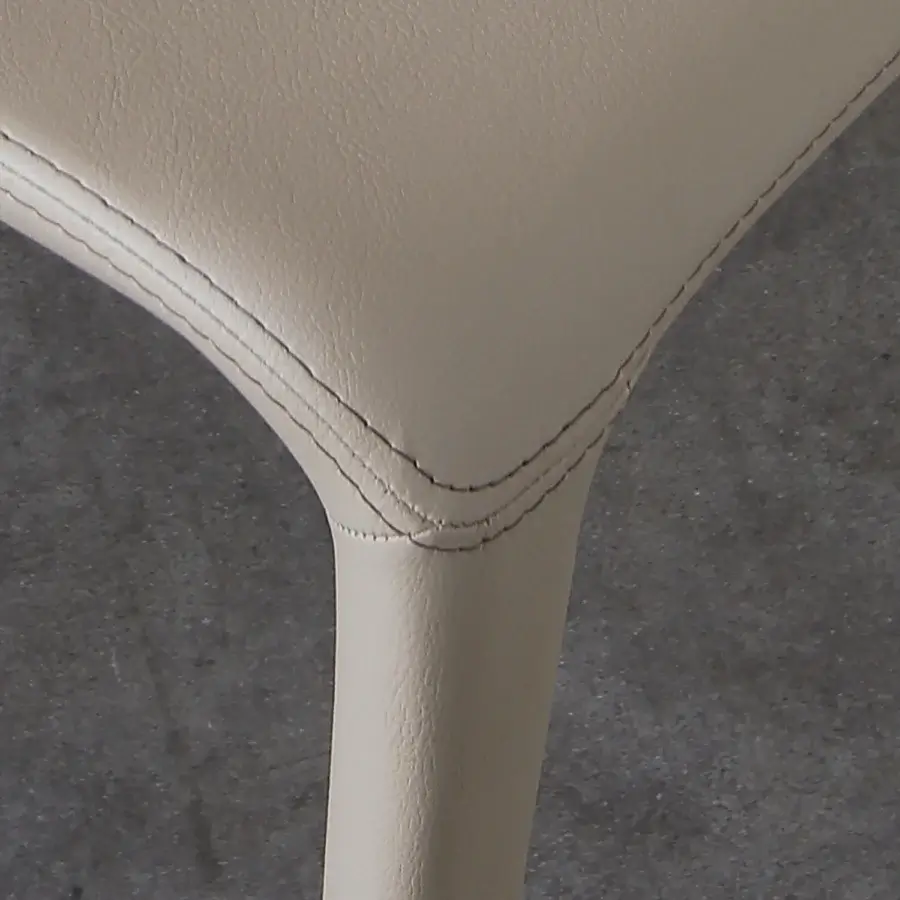 Distinguished Ivano Antonello Italia Malika dining chair with curved form in light beige synthetic leather and steel frame