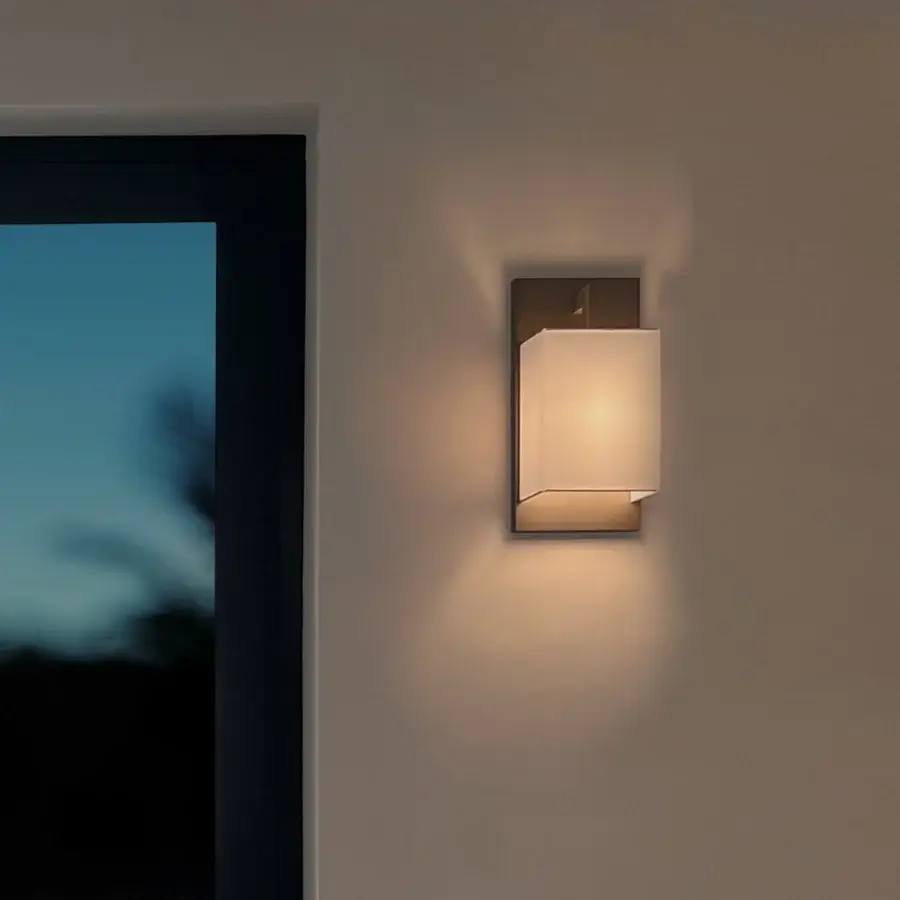 Distinguished Contardi Heritage Coconette wall lamp with linen lampshade and subtly textured bronze-toned metal backplate sold as a set of two