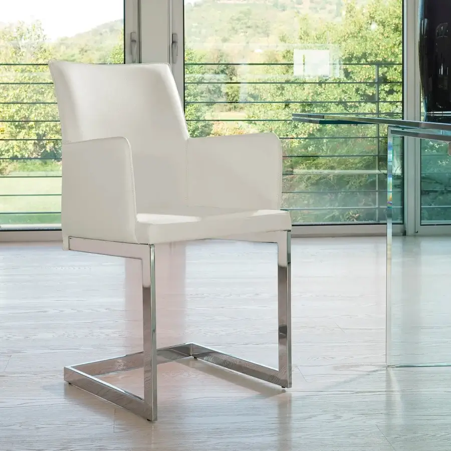 Distinguished Ivano Antonello Italia Sonia dining chair with white leatherette and rigorously geometric polished steel frame