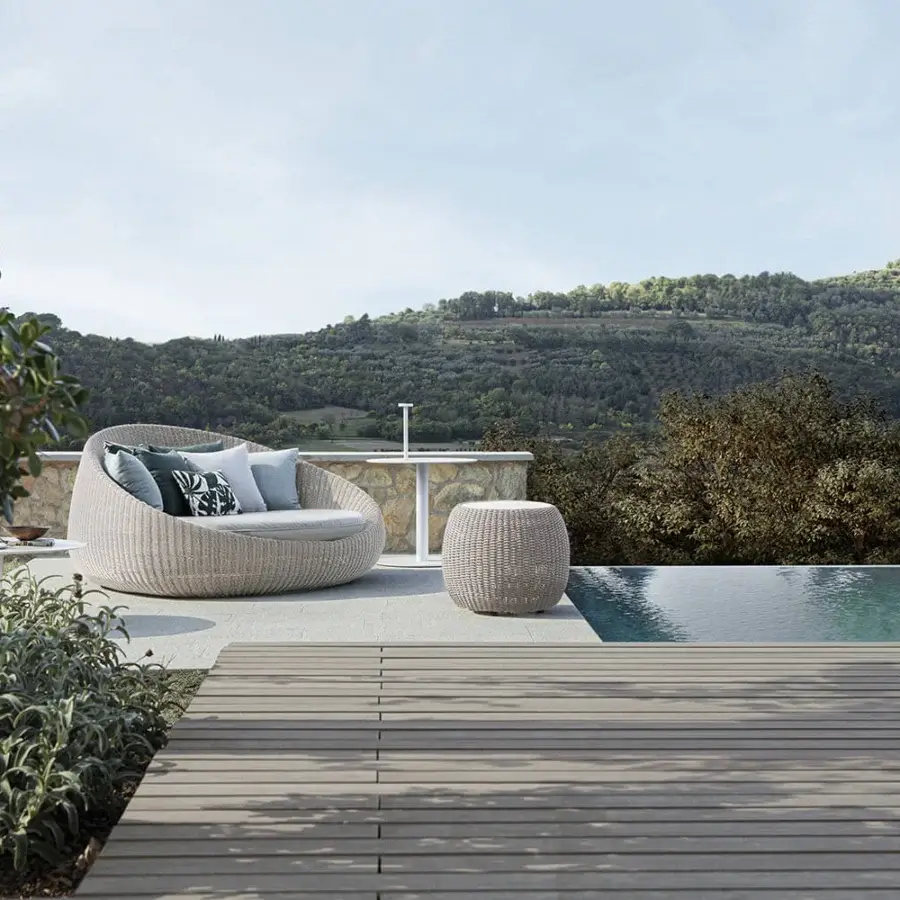 Superior Atmosphera Twiga daybed crafted with aluminum, epoxy paint, hand-woven synthetic rattan and plush green and blue cushions