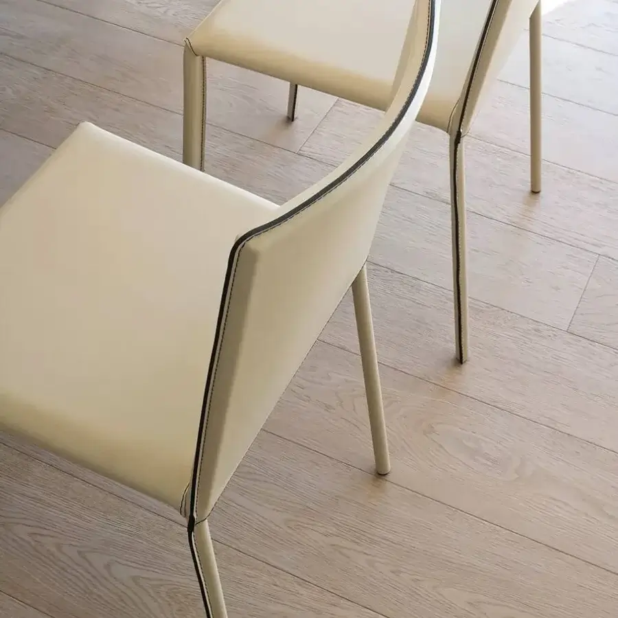Superior Ivano Antonello Italia Luna chair with supple leather upholstery and refined steel frame in a pale cream hue