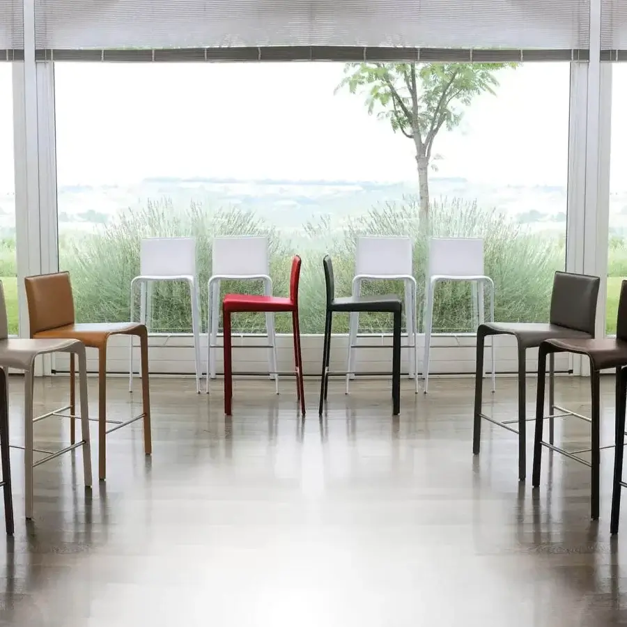 Distinctive Ivano Antonello Italia Rey stool with molded seat and sleek metal base in a striking red hue with satin finish