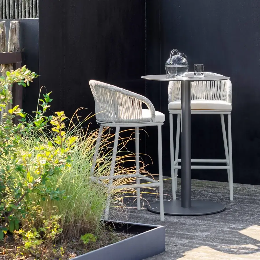 Distinguished Atmosphera Net B table with a circular gray metal tabletop and cylindrical pedestal built in galvanized steel with powder-coated finish