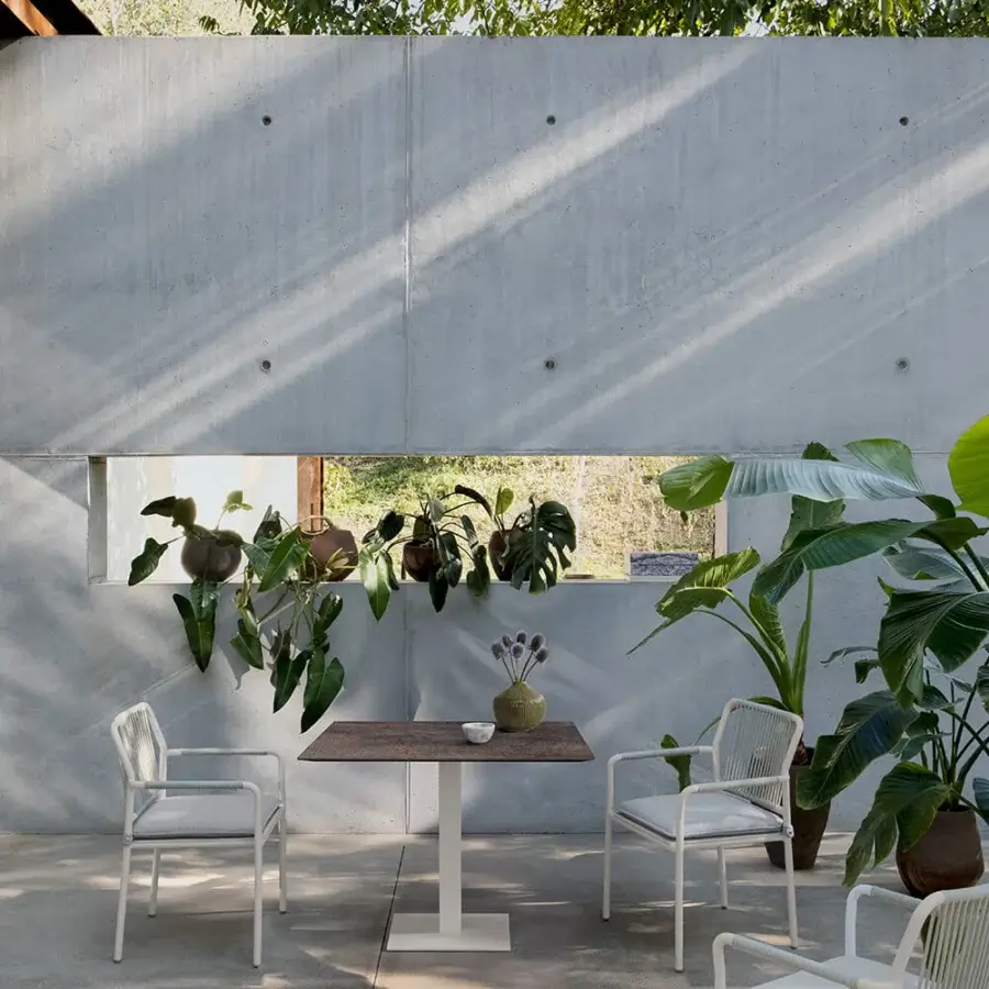 Exceptional Atmosphera Net Q table with warm medium brown Teak wood and a robust galvanized steel frame in satin finish