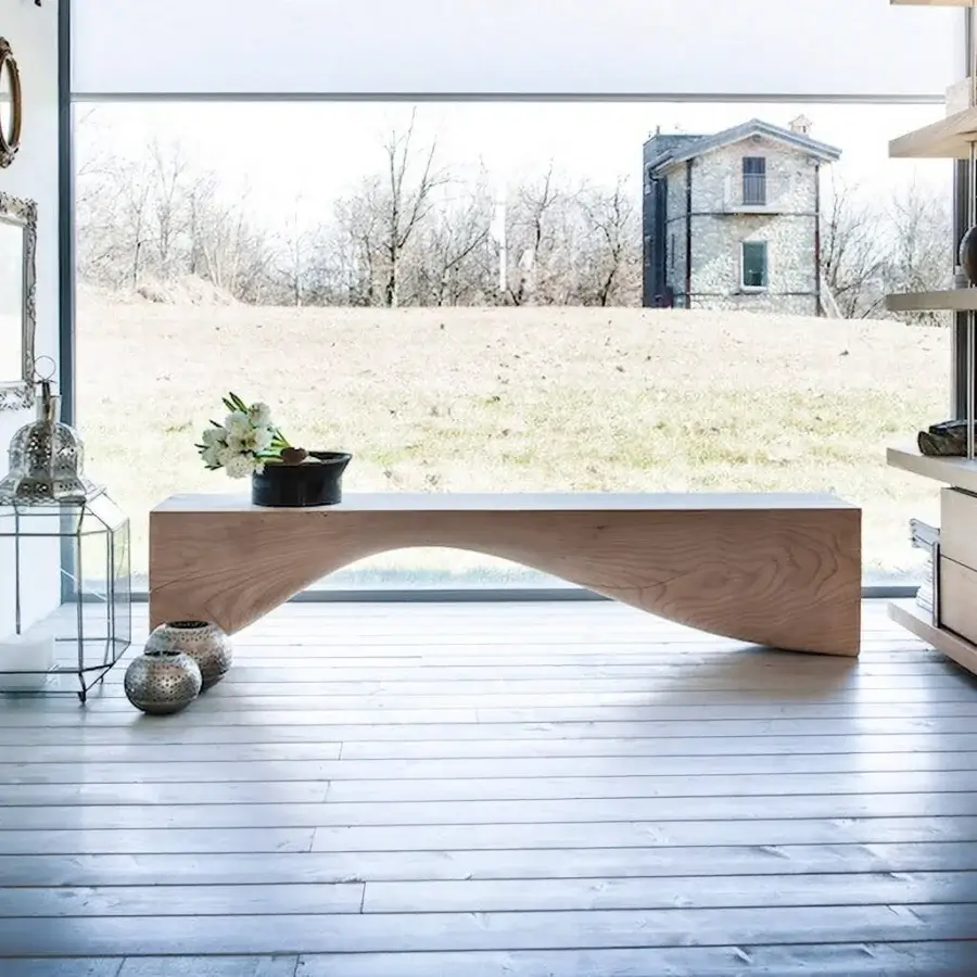 Elegant Riva 1920 Curve bench sculpted from scented Cedar of Lebanon exhibiting a warm light brown tone and matte finish
