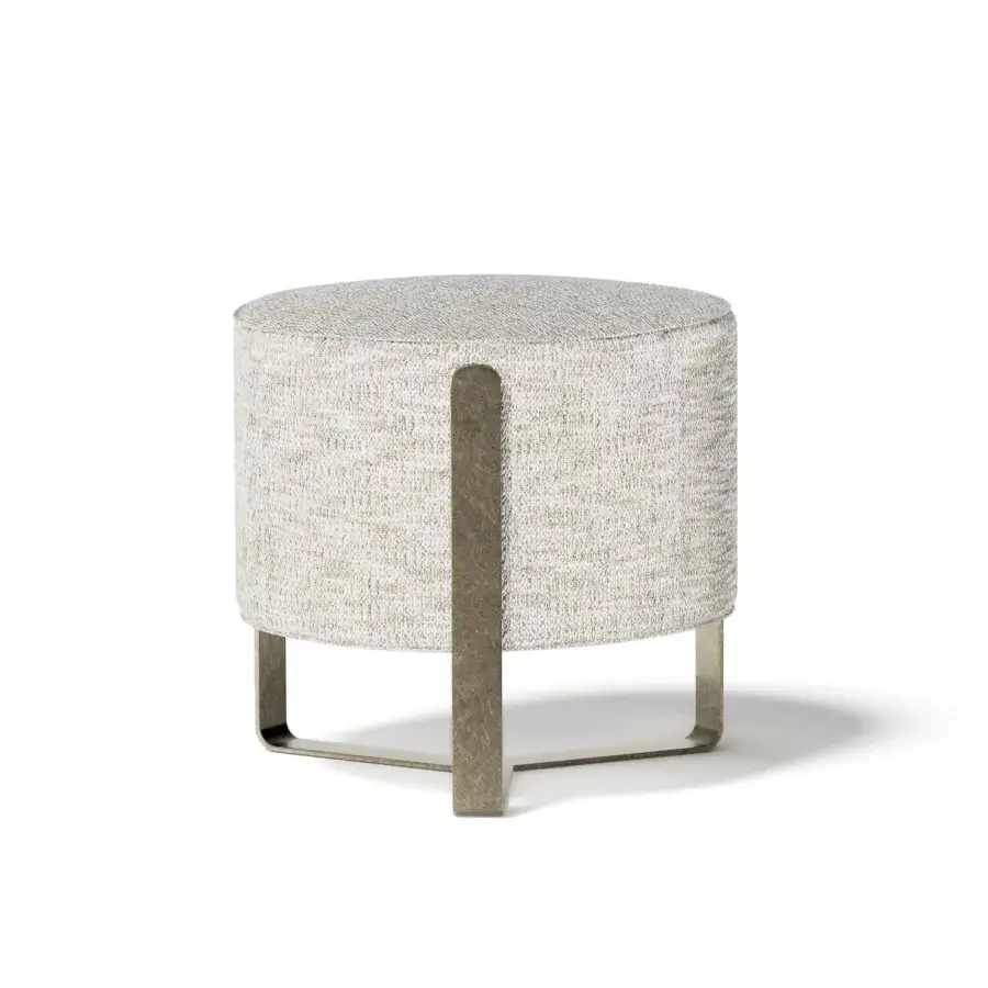 Elegant Capital Aurea ottoman with neutral beige textured fabric and subtle grayish-bronze metal accents crafted with a rounded silhouette
