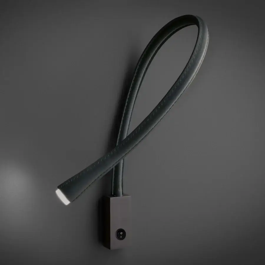 Exceptional Contardi Flexiled wall lamp with a flexible brass arm encased in a transparent sheath, muted green-grey tone and matte finish