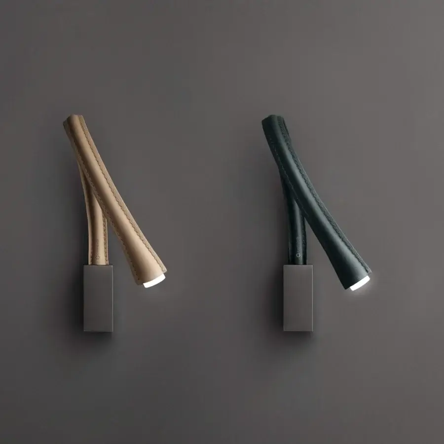 Distinguished Contardi Flexiled wall lamp with a flexible brass arm covered in tan double-side stitched leather and matte gray metal base