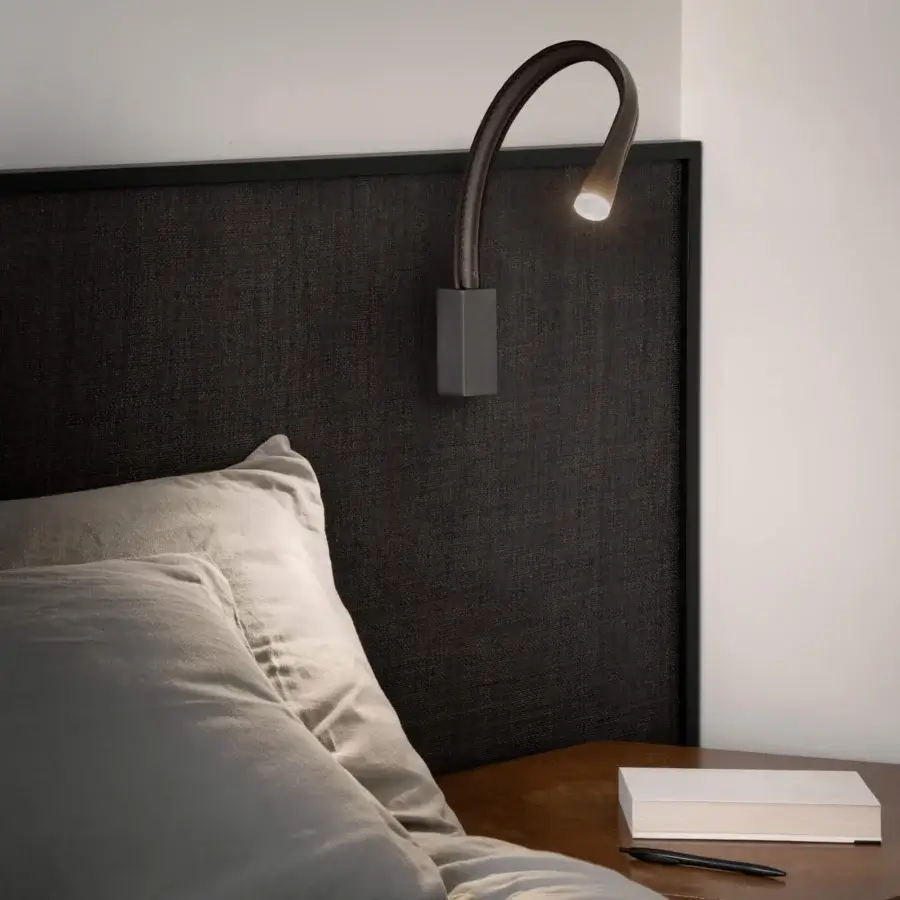 Superior Contardi Flexiled wall lamp with a flexible brass arm encased in dark-toned steel mesh and transparent sheath with a matte finish