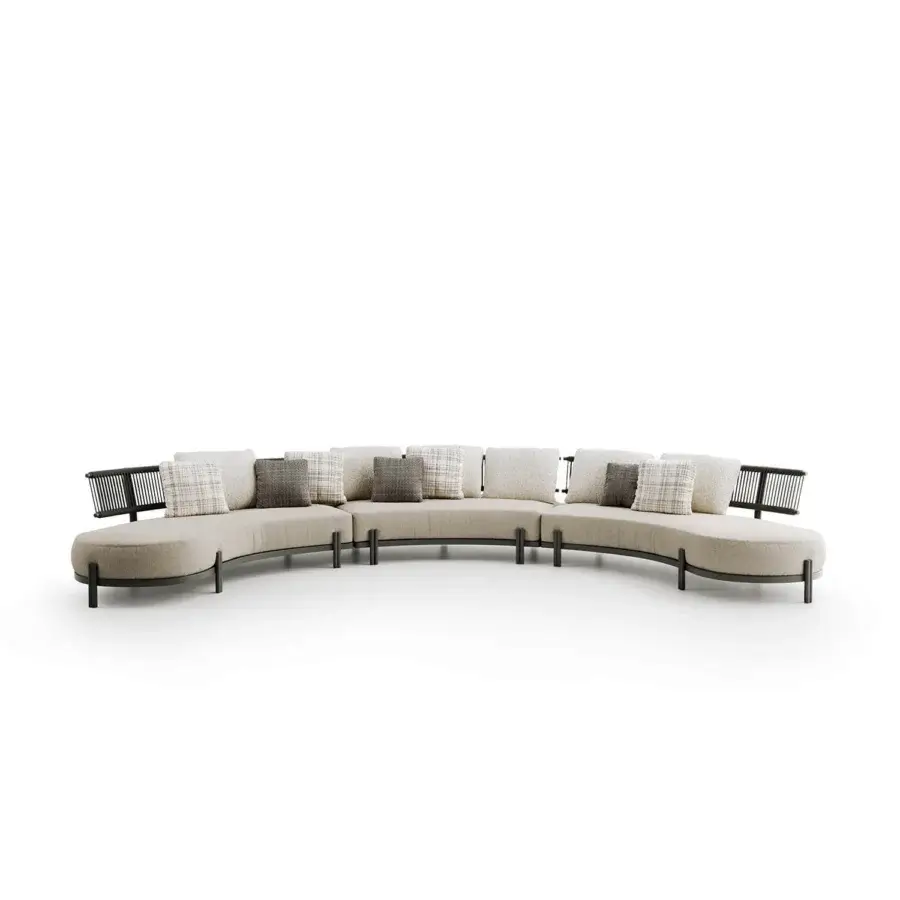 Elegant Atmosphera Loto sectional with a curved form crafted in neutral beige textile and dark-toned metal with textured cushions