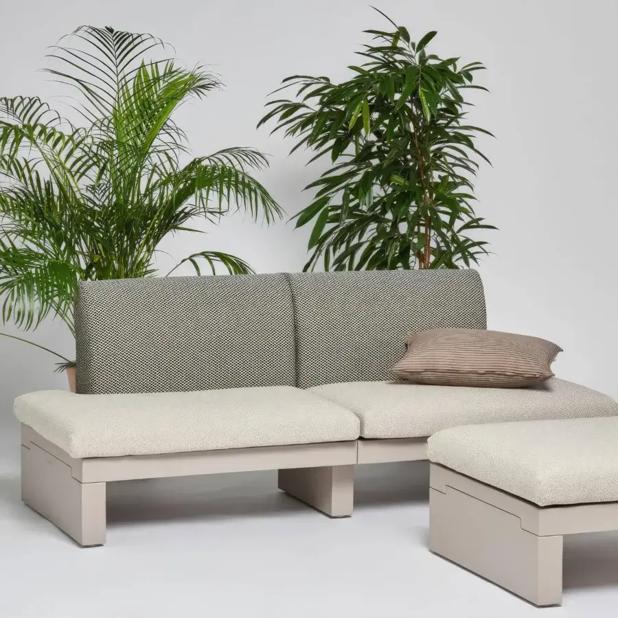 Elegant Serralunga Riviera sofa built in durable LLDPE with matte finish and textured neutral beige cushions accented with subtle gray