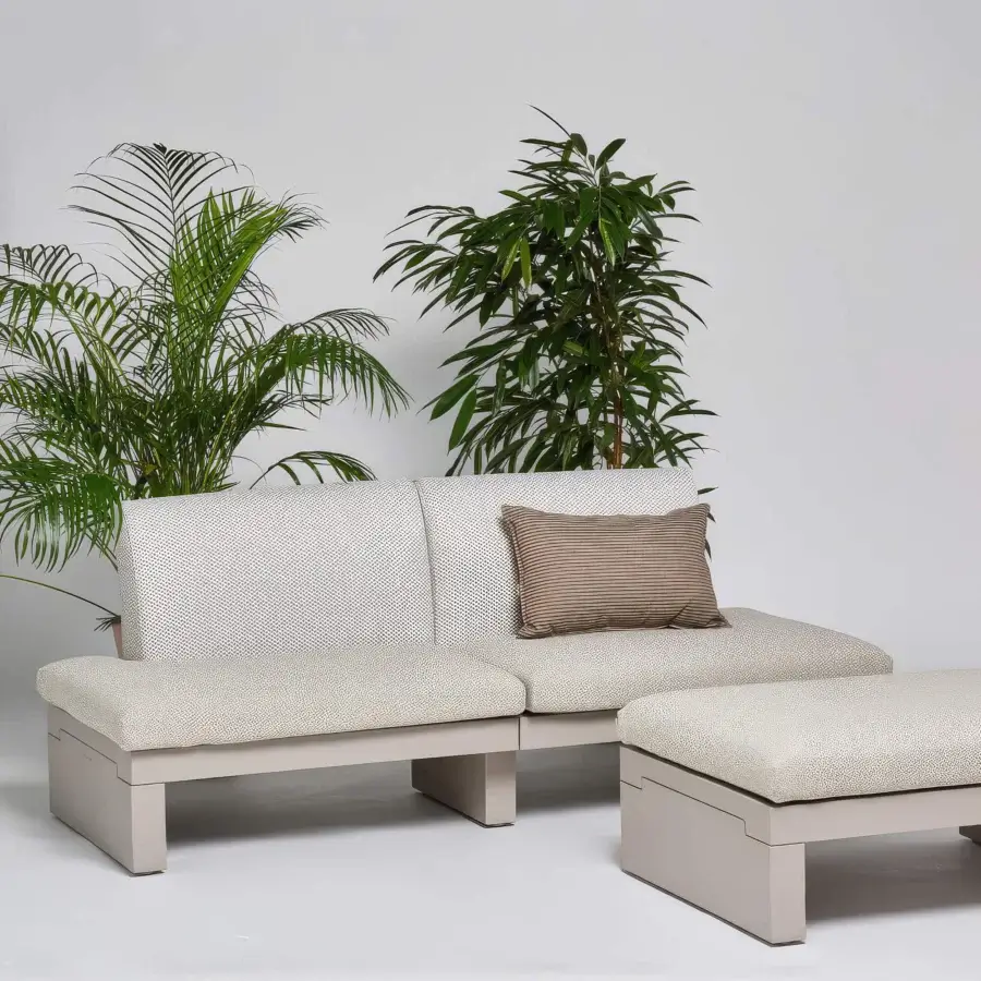 Distinguished Serralunga Riviera sofa crafted in speckled light beige LLDPE with a minimalist angular aesthetic and block-shaped cushions