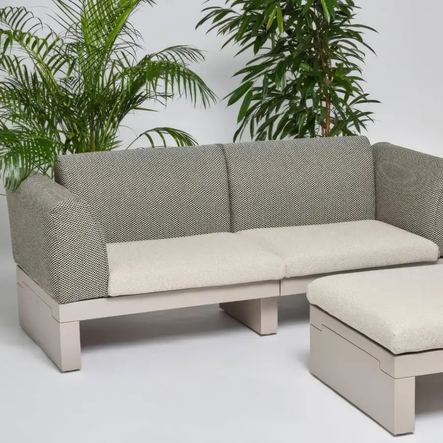 Distinguished Serralunga Riviera sofa crafted in matte beige LLDPE with dark gray and white patterned cushions for contemporary outdoor seating