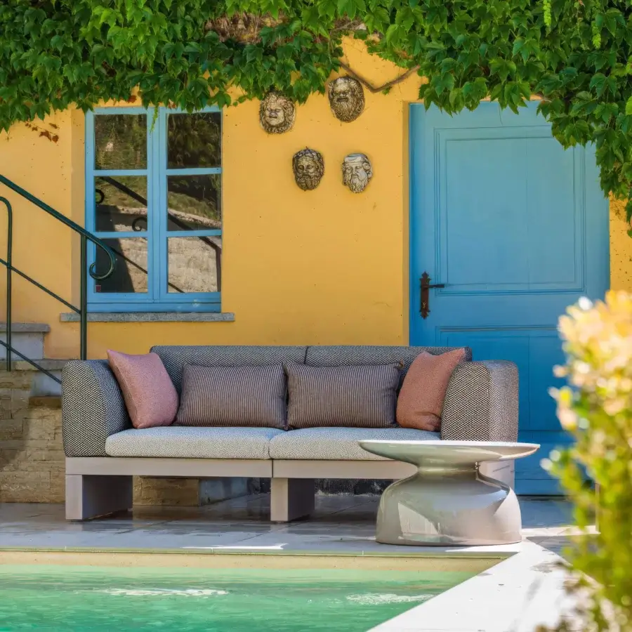 Sophisticated Serralunga Riviera sofa crafted in light gray LLDPE with plush cushions in gray, blush pink and darker stripes