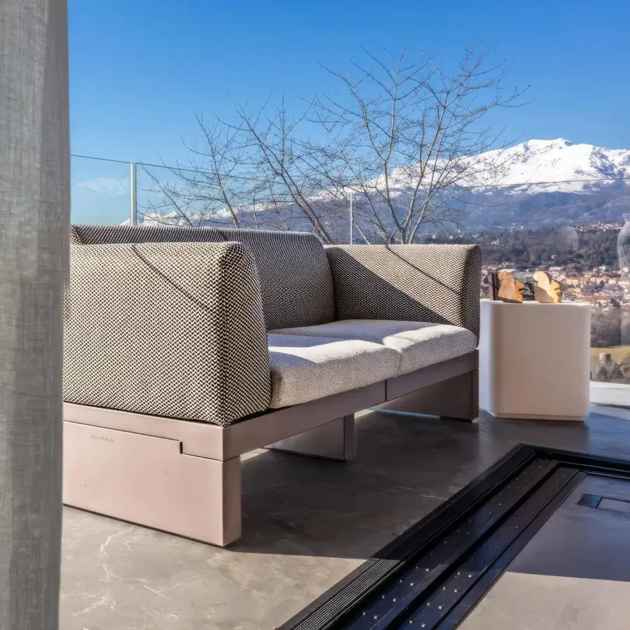 Distinguished Serralunga Riviera sofa built in muted gray-brown LLDPE with textured textile upholstery and smooth armrests with matte finish