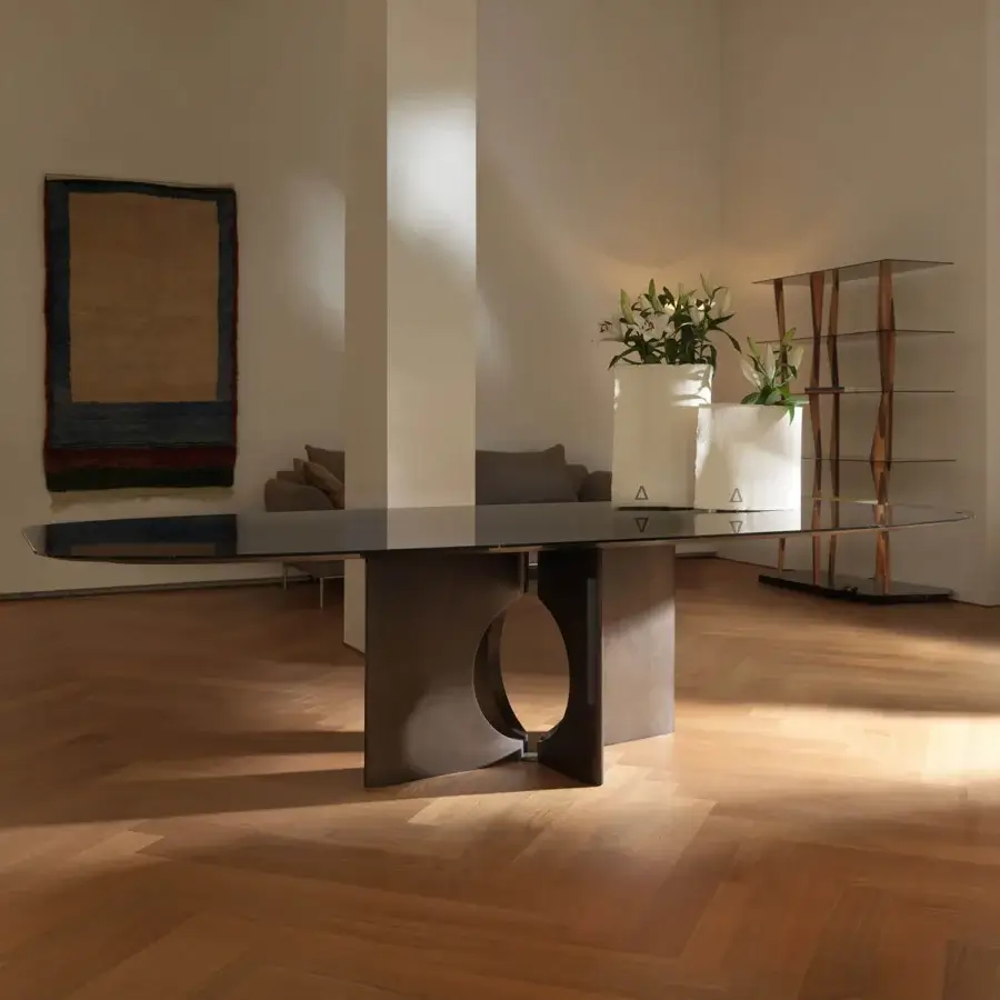 Distinguished Horm Brion table crafted with dark reflective glass tabletop and matte finish dark-toned wood base featuring arched opening