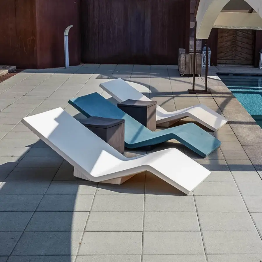 Distinguished Serralunga Aqua Lounger with wave-like form crafted in durable LLDPE exhibiting white with teal and gray-blue accents and a matte finish