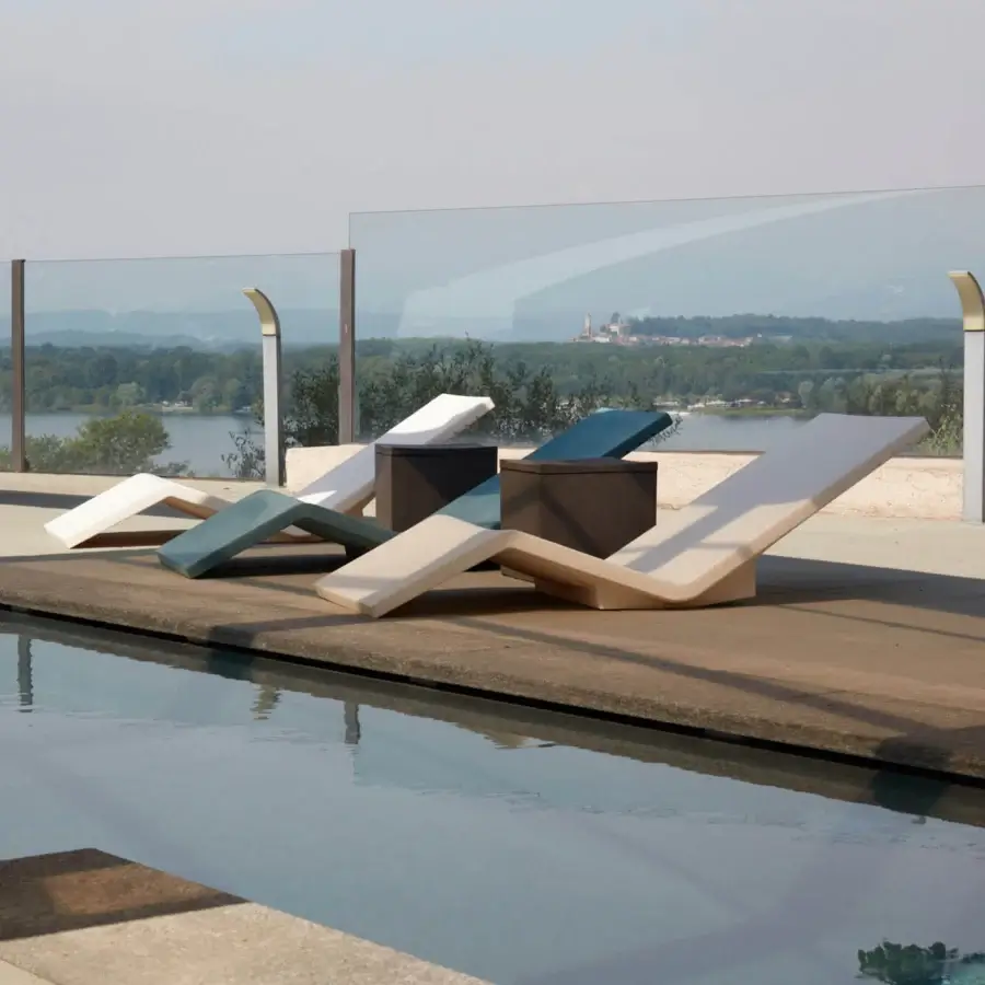 Elegant Serralunga Aqua Lounger set with neutral tones and smooth matte finish crafted in durable recyclable LLDPE