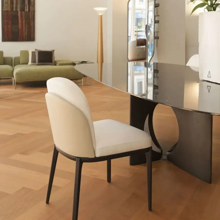 Elegant Horm Piccadilly chair with subtly textured light beige fabric upholstery and matte black metal frame