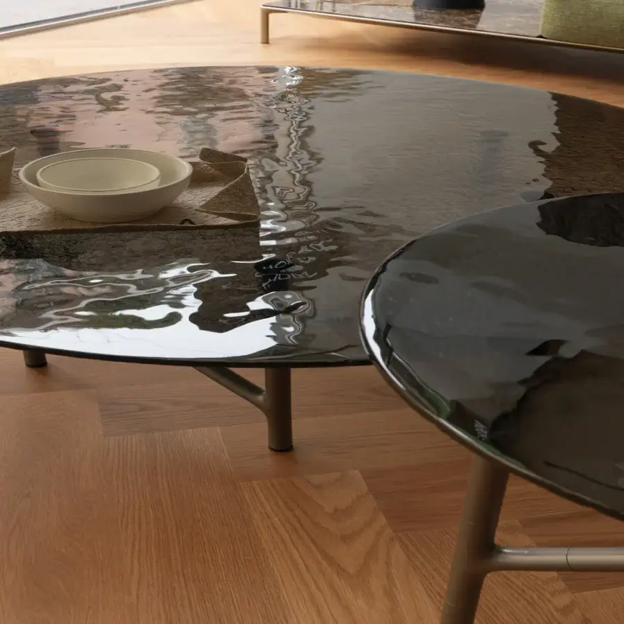 Distinguished Horm Alexander coffee table with a stunning hammered glass top and lightweight metal base crafted in a dark silvery tone