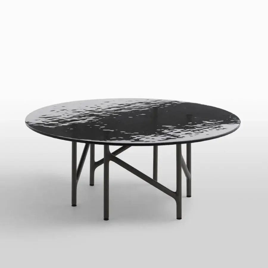 Distinguished Horm Alexander coffee table with a hammered glass top and refined black metal base