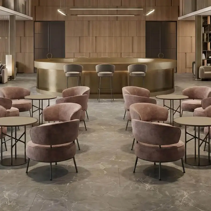 Distinctive Horm Vendome lounge chair with inviting rounded form and plush dusty rose textile upholstery supported by a sleek wooden base