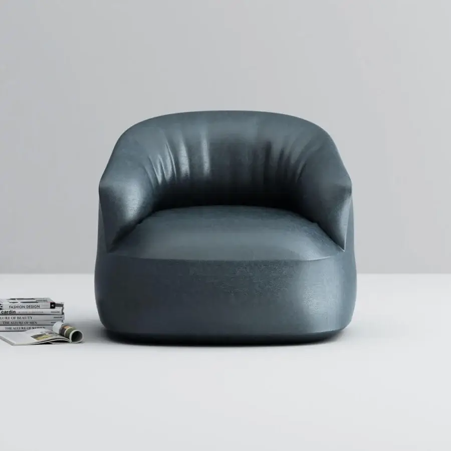 Superior Horm Edith swivel lounge chair with enveloping form upholstered in subtly textured dark teal-blue textile