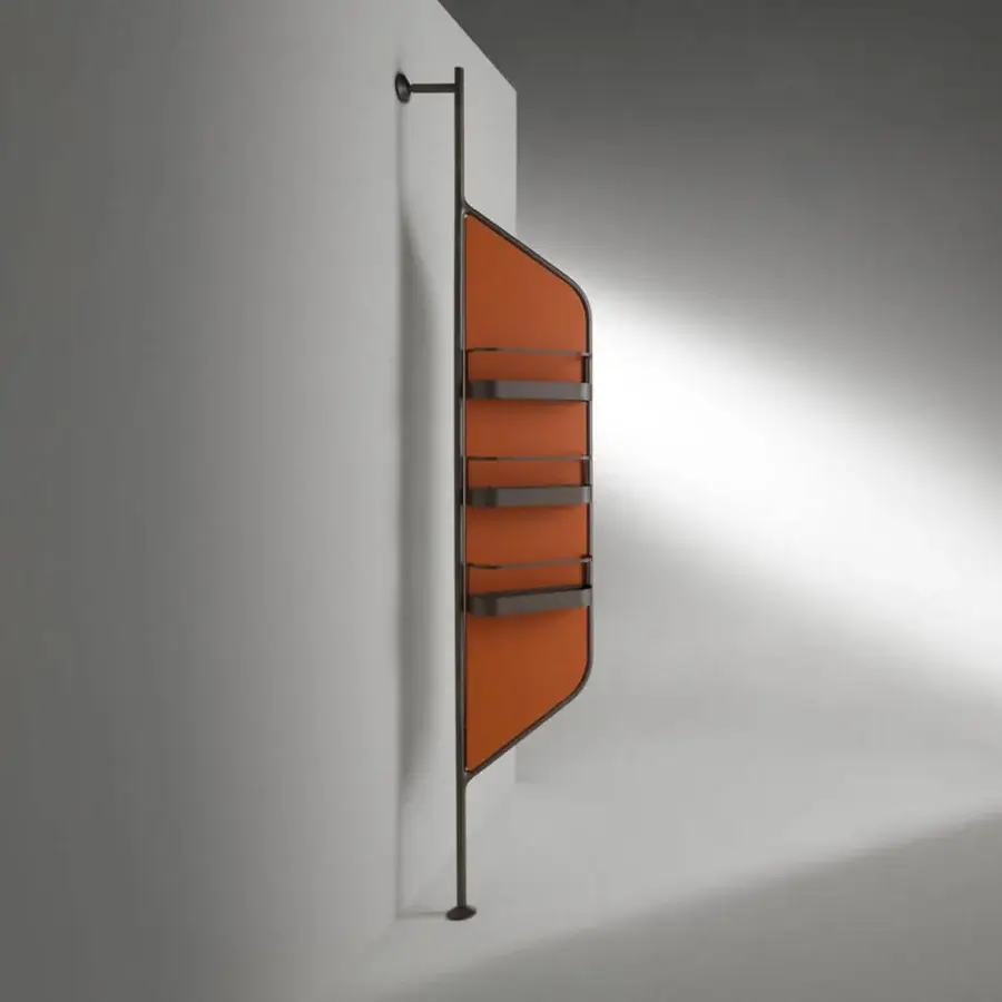 Elegant Horm Bebel mirror with terracotta panels and slender matte-finish metal, presenting a dynamic asymmetrical silhouette