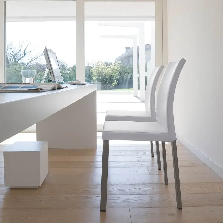 Superior Ivano Antonello Italia Barby dining chair crafted in white synthetic material with sleek metal legs