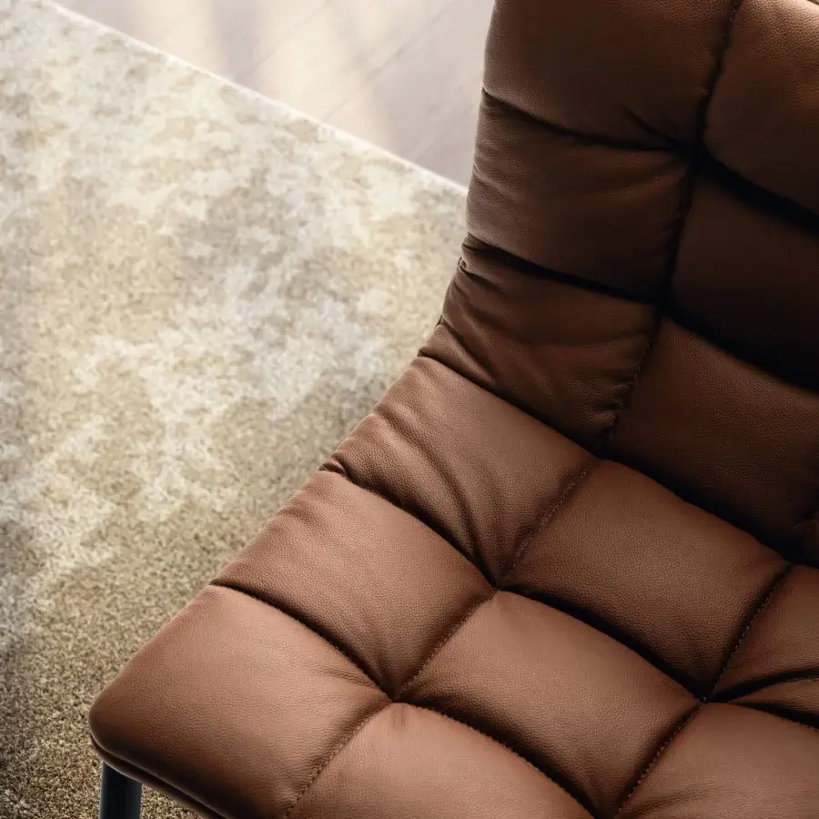 Superior Lago Mezz’aria chair with quilted medium-brown leather upholstery and a durable metal cantilevered frame