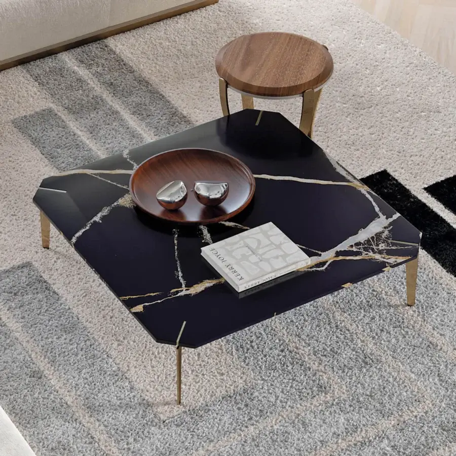 Captivating Capital Eclectic coffee table with black marble tabletop and sleek gold-toned metal legs
