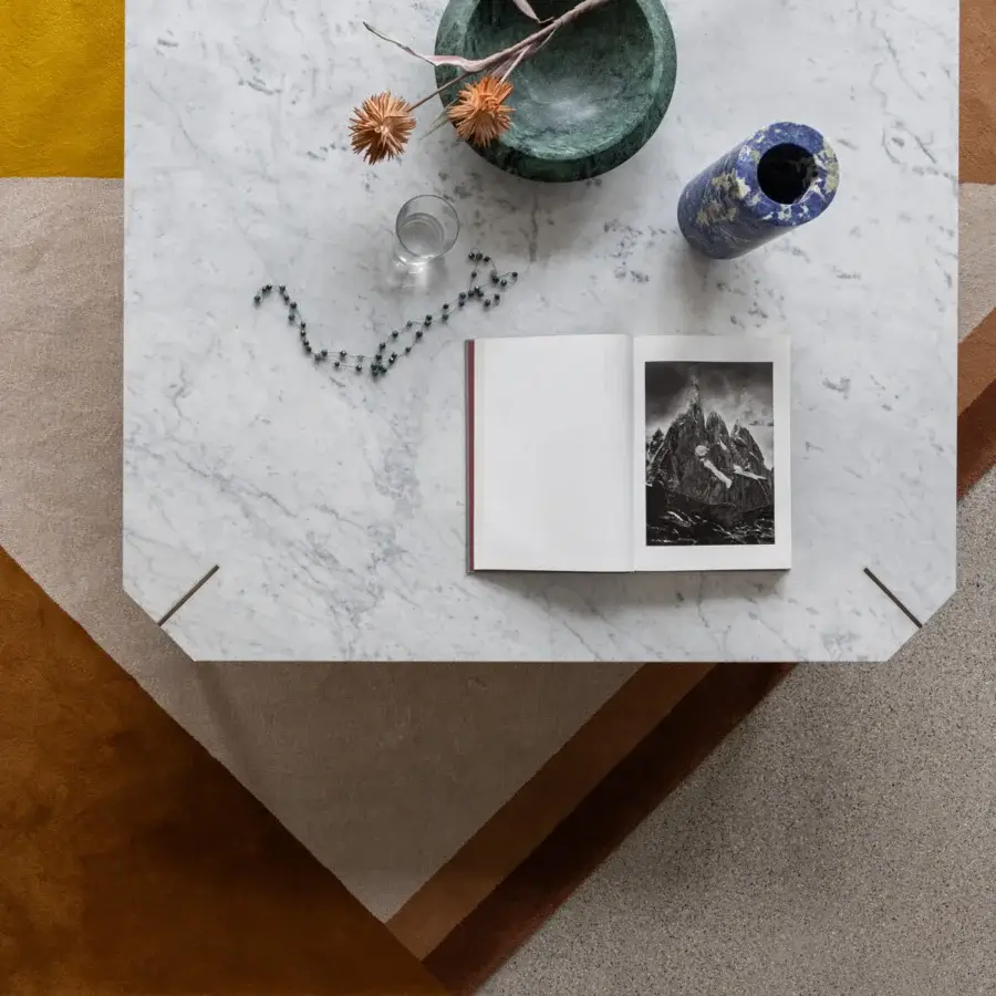 Distinguished Capital Eclectic coffee table with polished white marble tabletop and warm brown wood base crafted with sleek angled legs