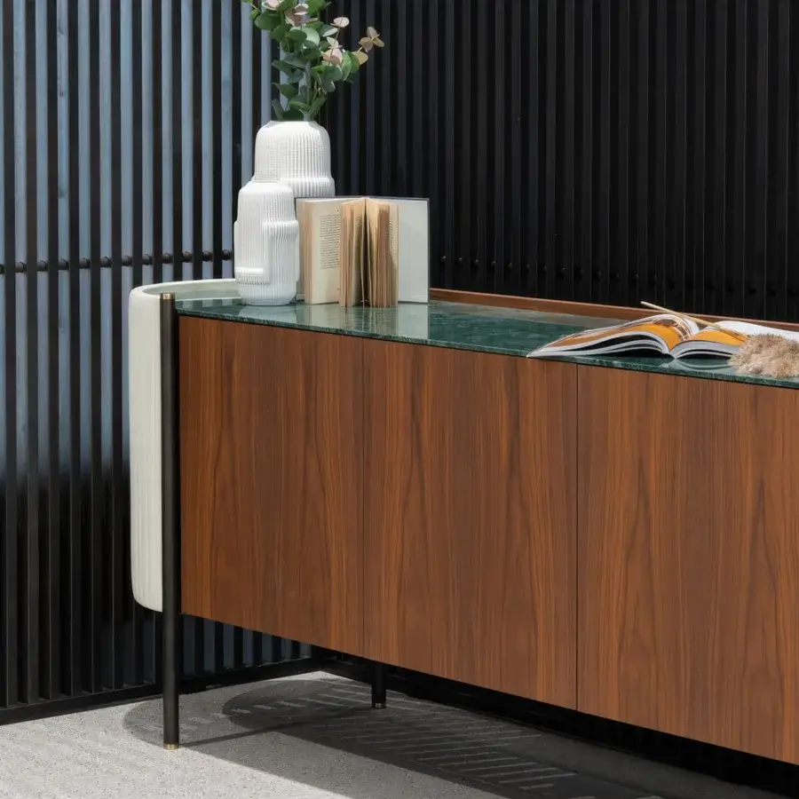 Distinguished Capital Karin sideboard with warm brown wood grain, subtle green polished stone, and cream textile panels revealing glossy black interiors