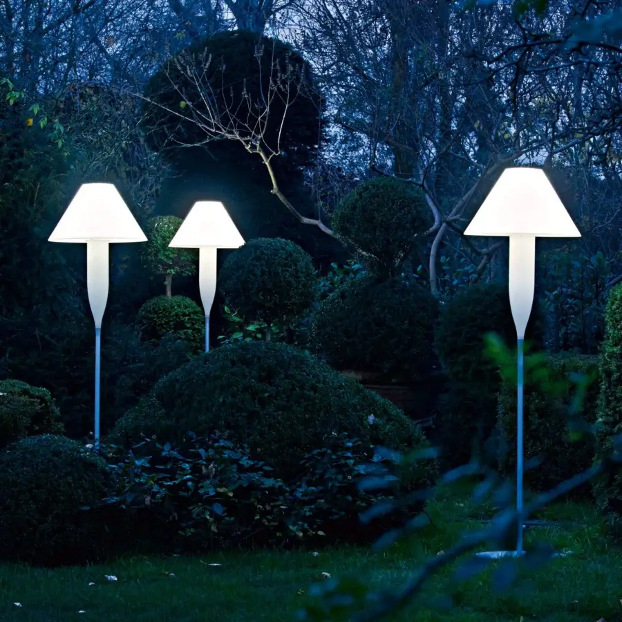 Elegant Serralunga Bonheur floor lamp with satin white shade and pale blue recyclable LLDPE, emitting ambient glow