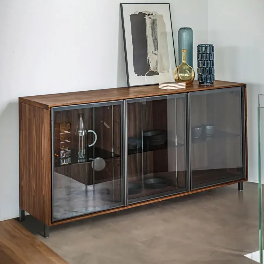 Architectural exquisite sideboard crafted with a hand-finished solid wood frame and grey-tinted glass doors in aluminum with integrated lighting