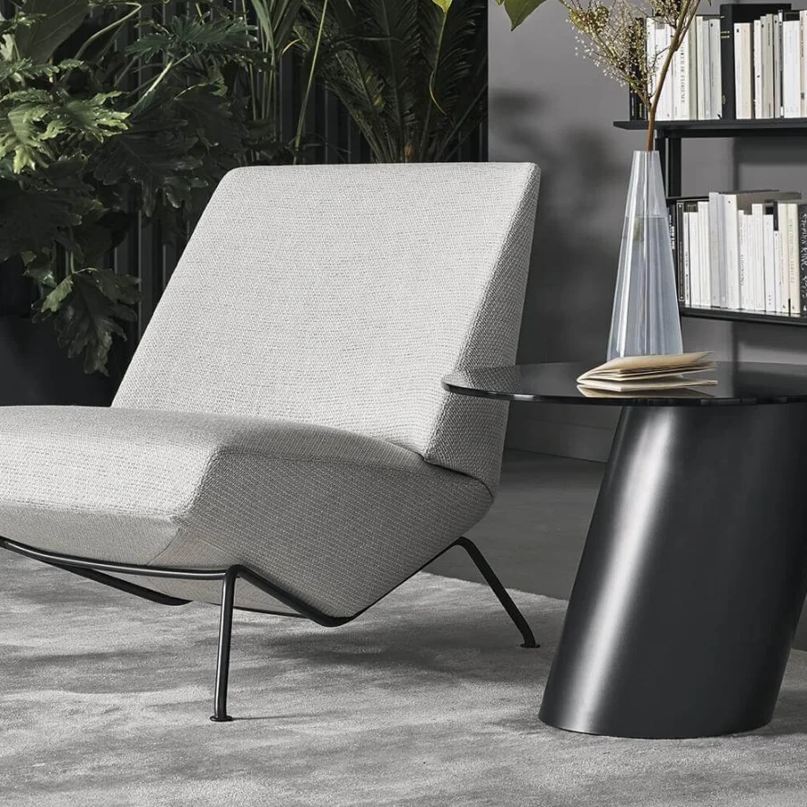 Elegant Bonaldo Pisa coffee table with leaning metal base and glossy black finish exhibiting geometric purity