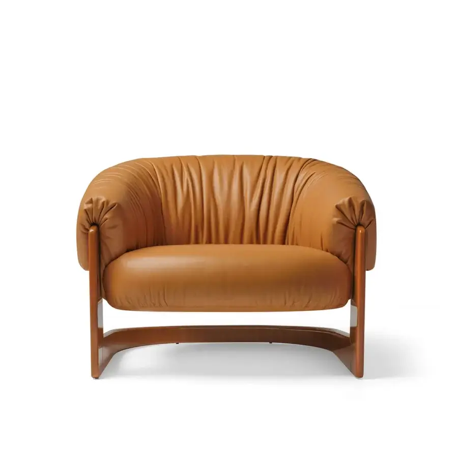 Exclusive Visionnaire Hampshire lounge chair in tan satin‑finish leather with high‑gloss birch base and fluid silhouette