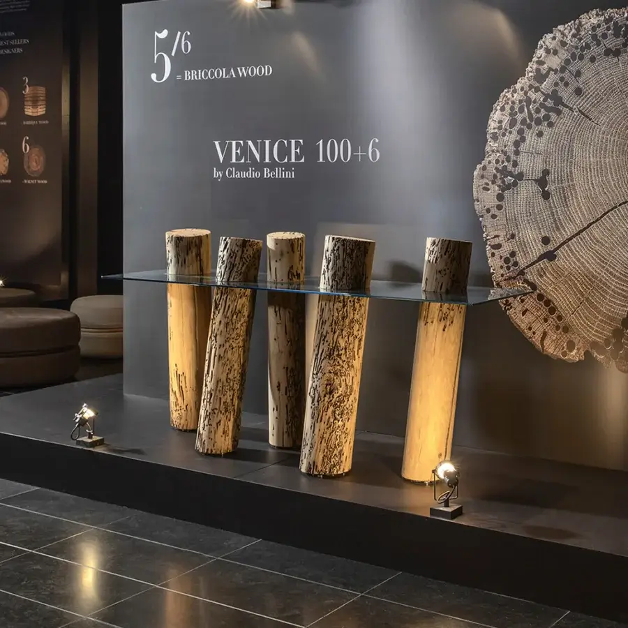 Elegant Riva 1920 Venice 100+6 console with glossy glass top and five organic wooden cylinders.
