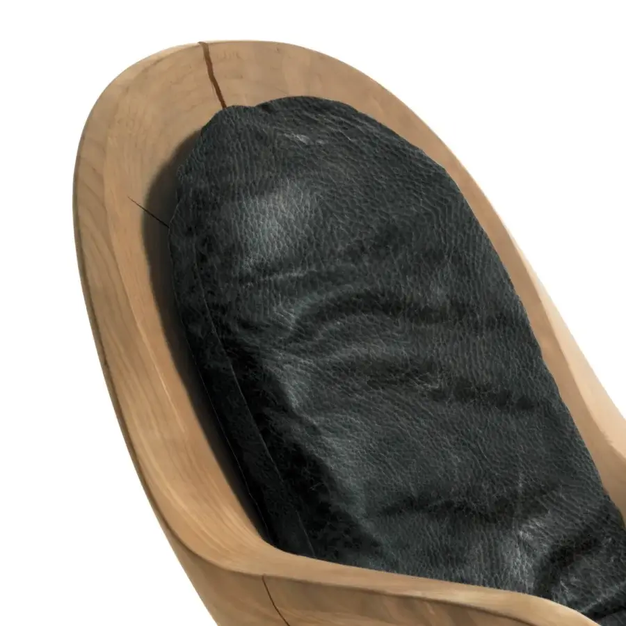 Elegant Riva 1920 Creus lounge chair in cedar of Lebanon with natural gloss, dark grey‑black leather‑like cushion, iron leg