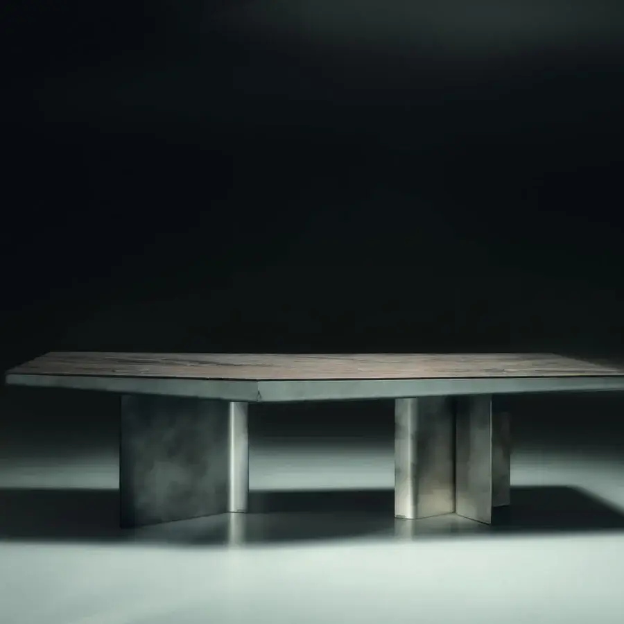 Luxury Visionnaire Catskill table with polished stone slab in muted brown‑grey tones and satin‑finished metal legs