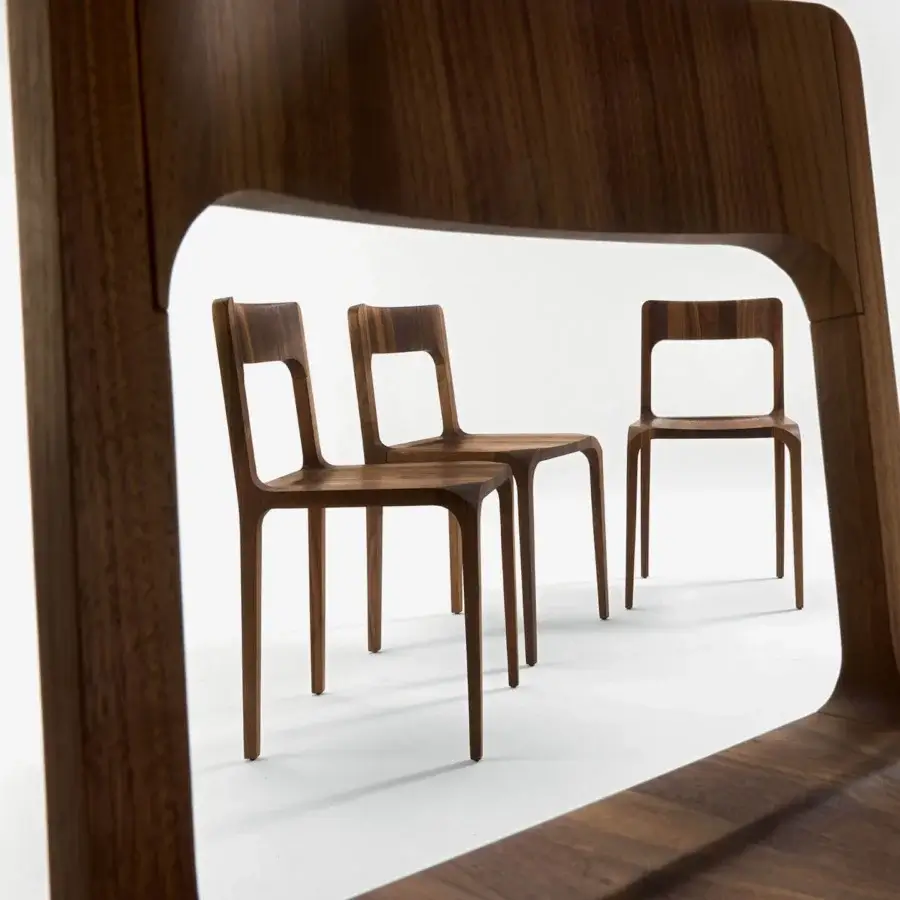 Elegant Riva 1920 Sleek chair with solid wood, medium‑to‑dark brown grain and satin matte gloss, tapered backrest and rectangular cutout