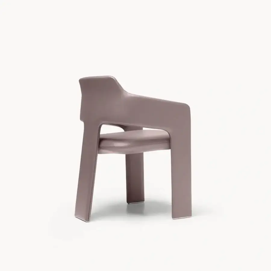 Contemporary Rochester armchair with muted mauve upholstered shell, clean frame, tapered legs, metallic leg caps